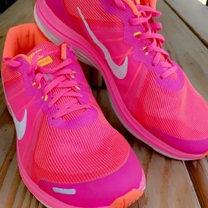 Nike athletic shoes. Size 11 women’s. Hot pink and orange.